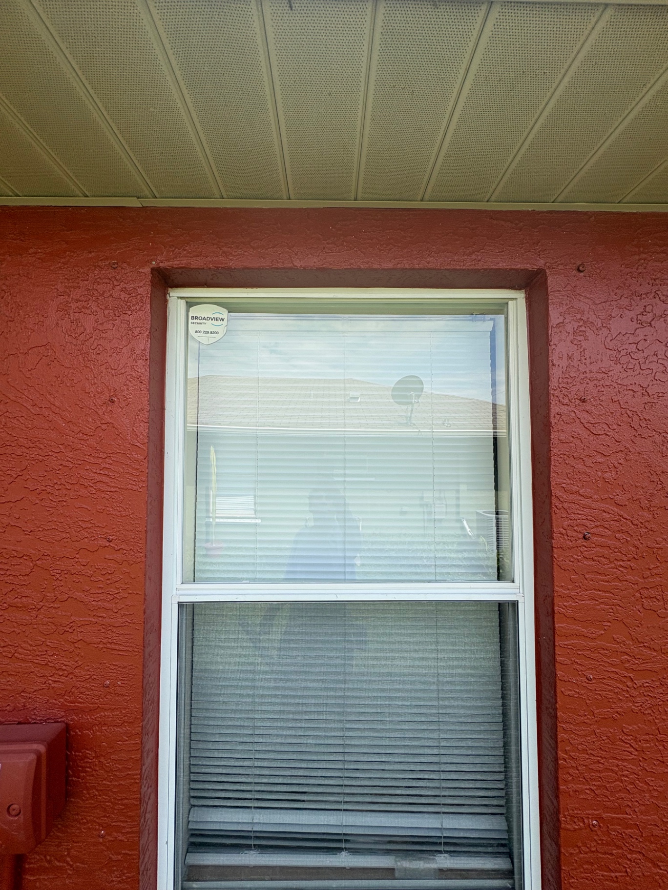 Residential window cleaned beneath a Florida home's soffit